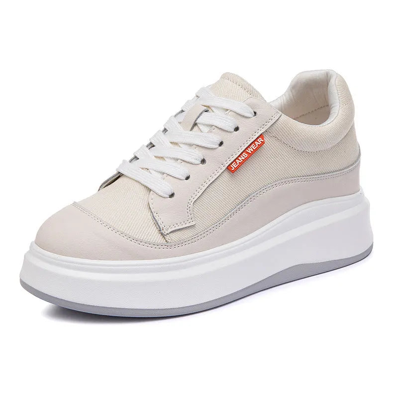 Women's pink leather board shoes with thick height-increasing sole on beige background