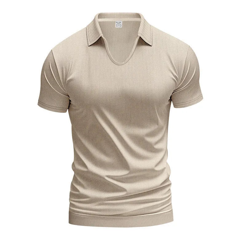 Man modelling a loose-fit apricot coloured V-neck short-sleeve T-shirt for casual summer wear.