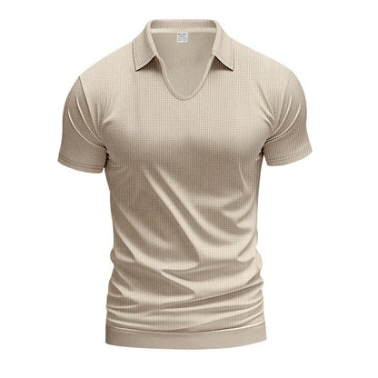 Man modelling a loose-fit apricot coloured V-neck short-sleeve T-shirt for casual summer wear.