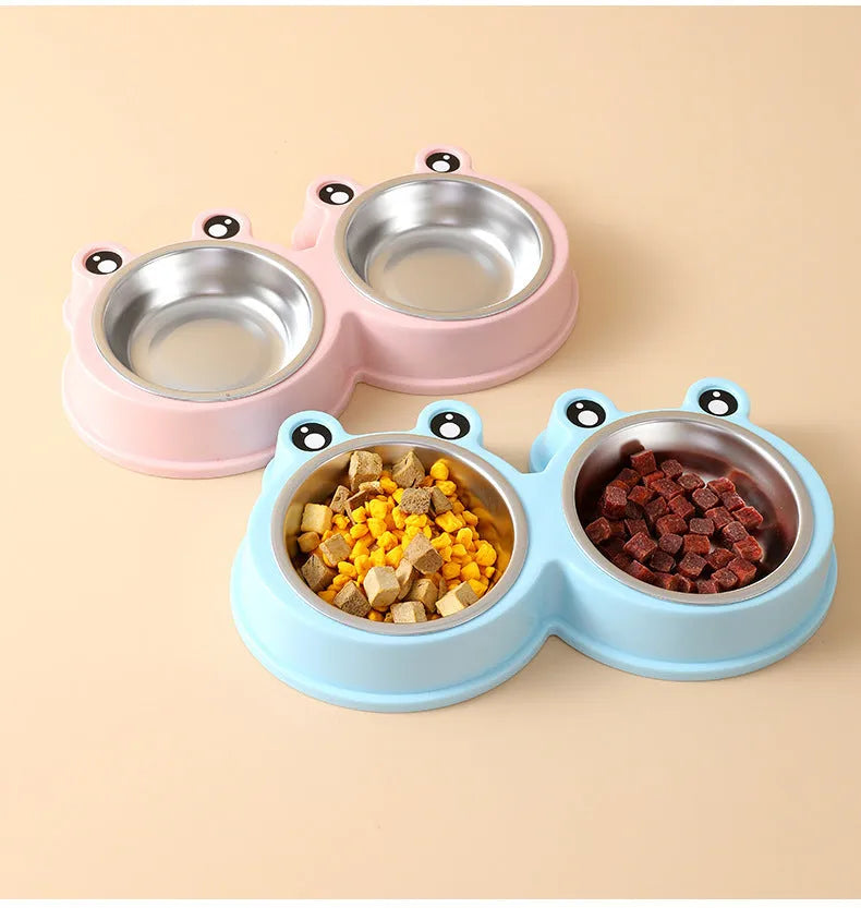 Stainless steel pet bowl with frog design and two compartments for food and water.