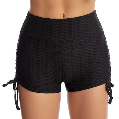 Curve-enhancing workout shorts in a variety of vibrant colors with a drawstring waistband for a customized fit.