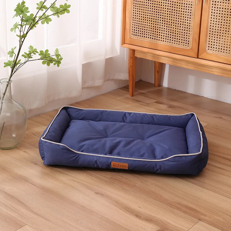 Waterproof dog sofa bed in grey Oxford cloth showing raised sides and rectangular shape