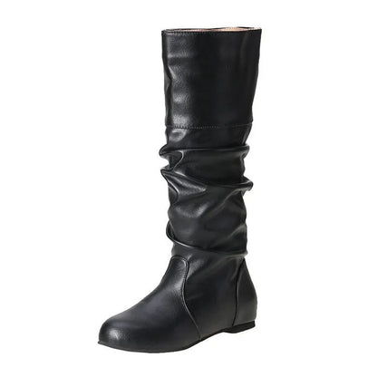 Women's flat heel long boots in black, slip-on style with a high cylinder shaft and rubber sole.