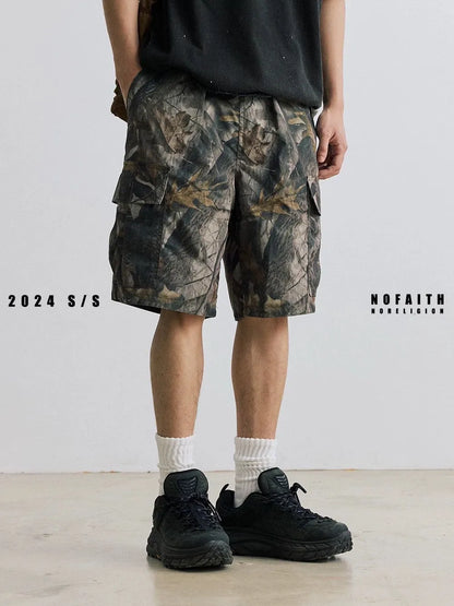 Women's loose fit denim shorts in army green colour, showing straight-leg cut and zip placket.