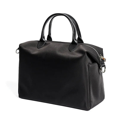 Waterproof nylon shoulder bag with leather accents in black or light khaki, showing 35cm width.