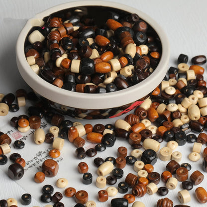 Mixed colour vintage solid wood beads scattered for DIY jewellery making and ethnic style craft projects