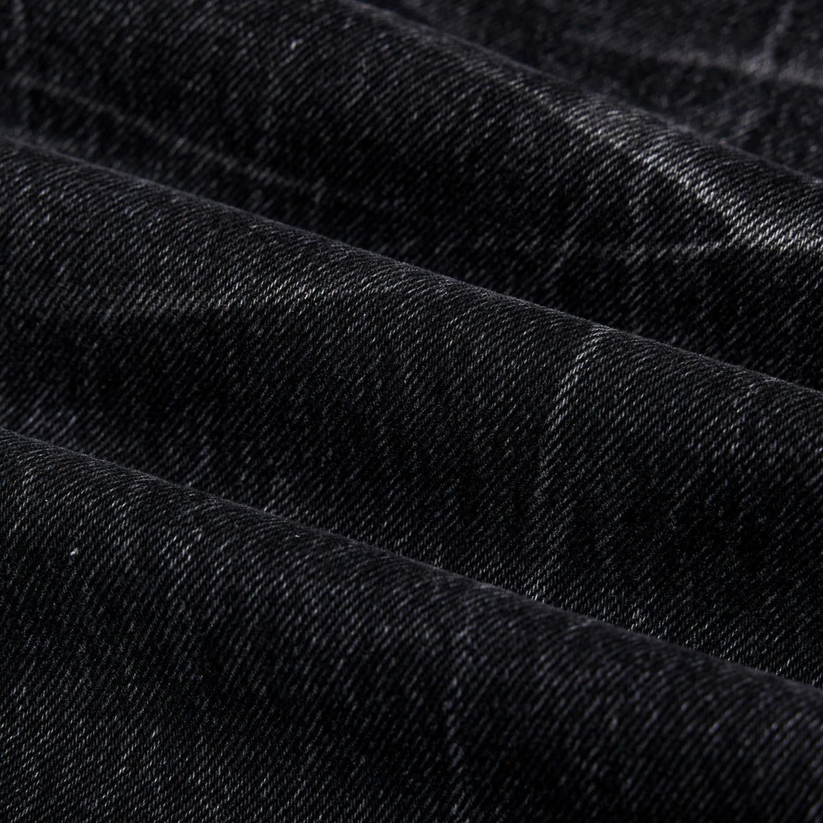 Men's black straight-leg jeans featuring a distinctive lightning crack washed pattern on the denim.