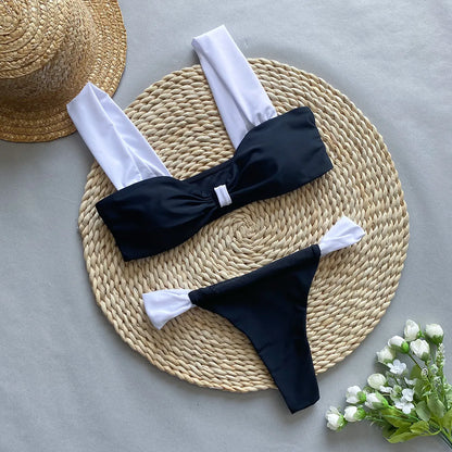 Women's black and leopard print bikini set with tube top and T-pants briefs on a mannequin.