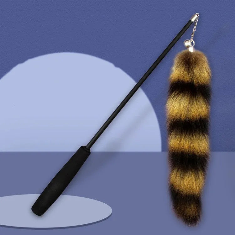 Black cat toy wand with a long elastic string and a feather teaser catcher for interactive play.