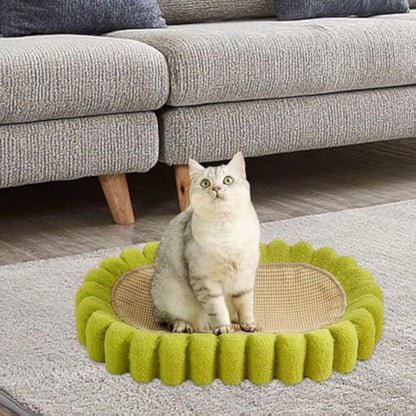 Green oval-shaped sisal cat scratching pad with a deep centre bowl for use as a cat bed.