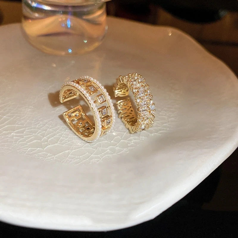 Elegant square ring with hollowed-out design and shimmering zircon stones, perfect for the stylish British woman