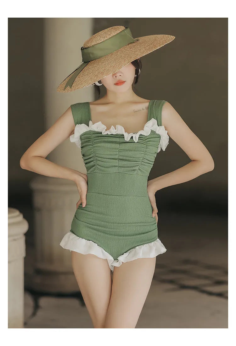 Women's black high-waisted one-piece swimsuit made from quick-drying polyester fabric.