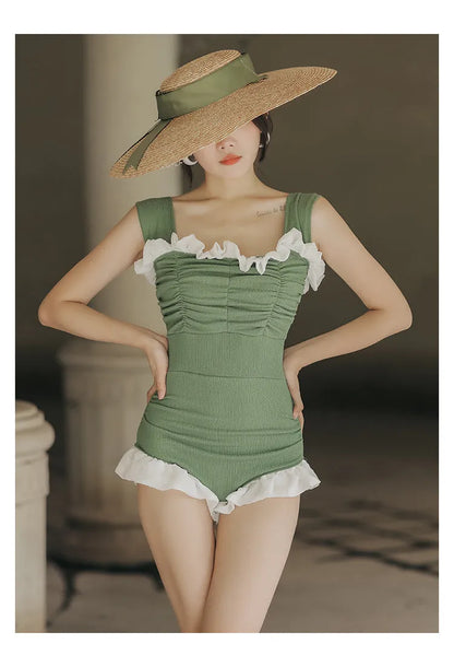 Women's black high-waisted one-piece swimsuit made from quick-drying polyester fabric.