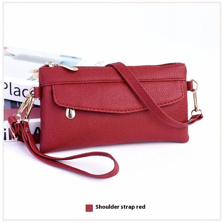 Soft surface square PU crossbody bag and clutch with internal zipper pocket in various colours.