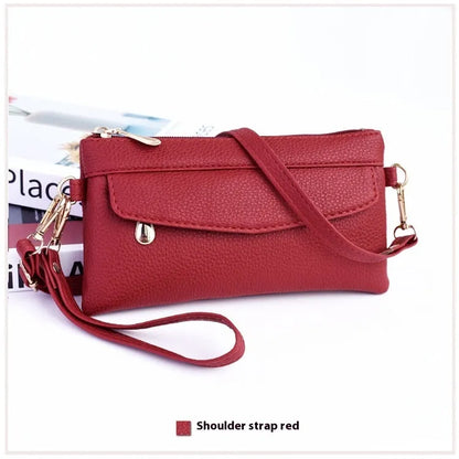Soft surface square PU crossbody bag and clutch with internal zipper pocket in various colours.