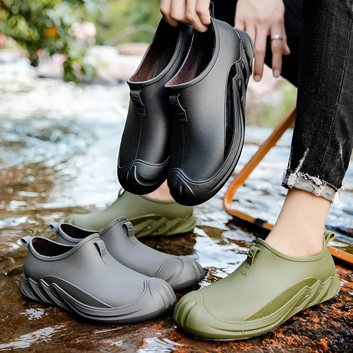 Men's short casual rain boot in solid colour, plastic upper, shown on foot.