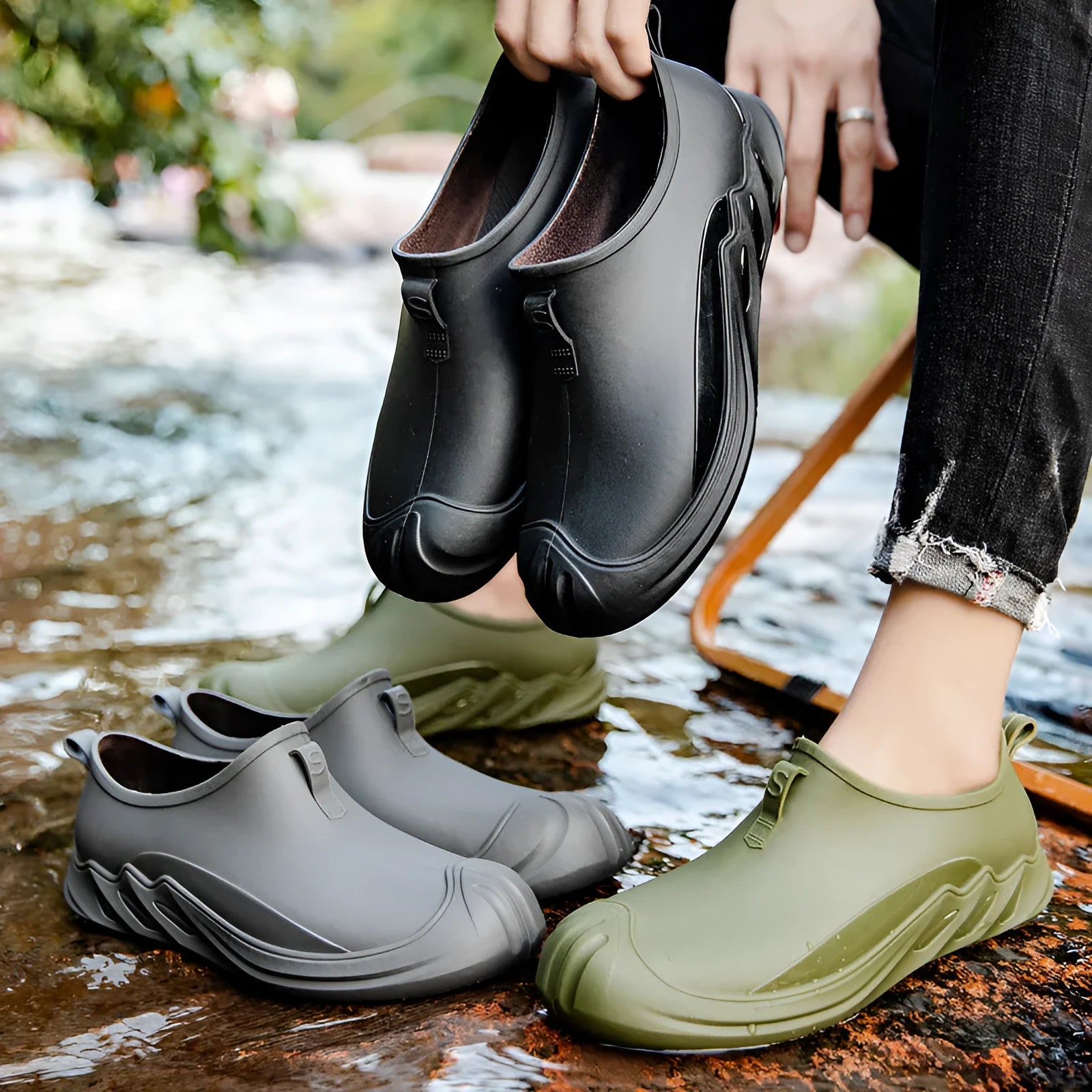 Men's short casual rain boot in solid colour, plastic upper, shown on foot.