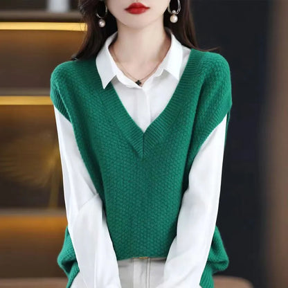 Women's creamy-white knitted sleeveless vest with 3D pattern, V-neck, worn as a layer over a shirt.