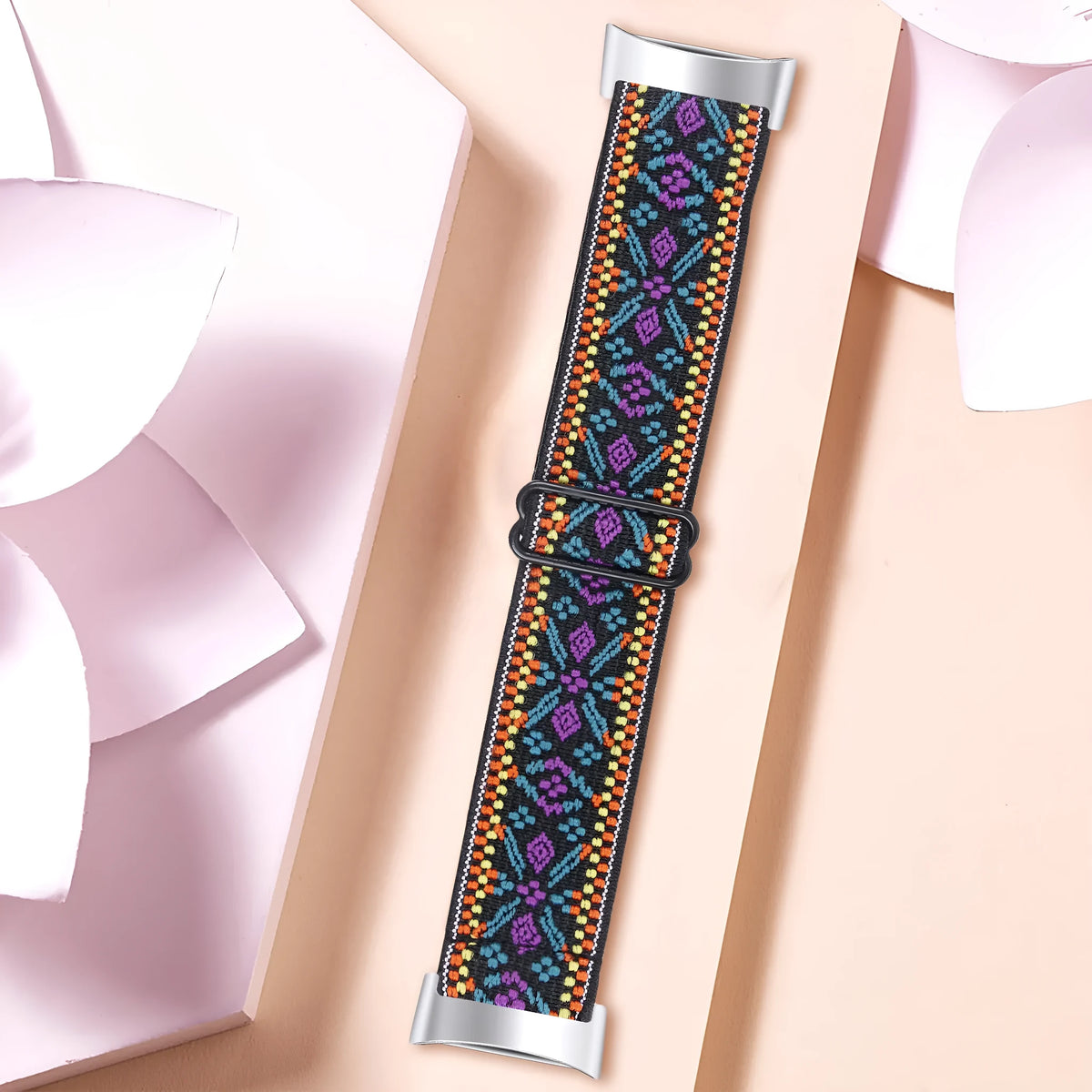 Printed elastic watch strap compatible with Fitbit Charge 6 shown in adjustable position