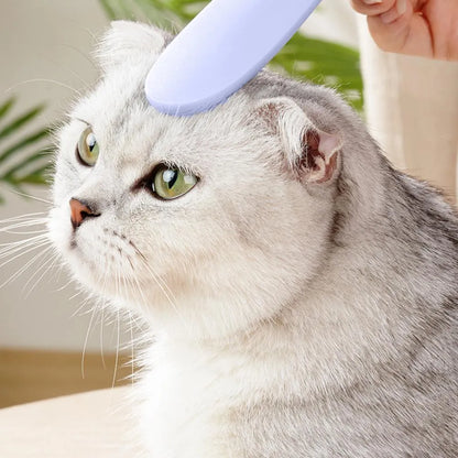 Grey and pink ABS plastic cat grooming comb with tongue-like texture and dual-ended design