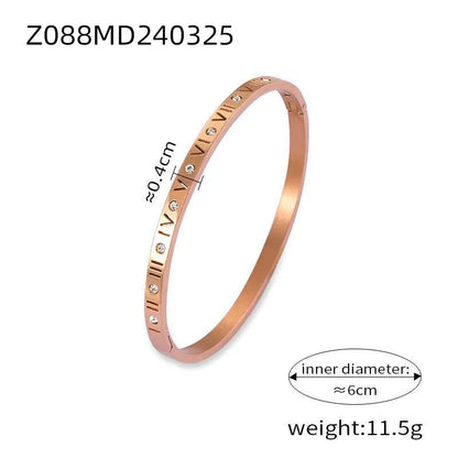 Titanium steel Roman numeral bracelet with gold plated carved design and diamond-embedded detail