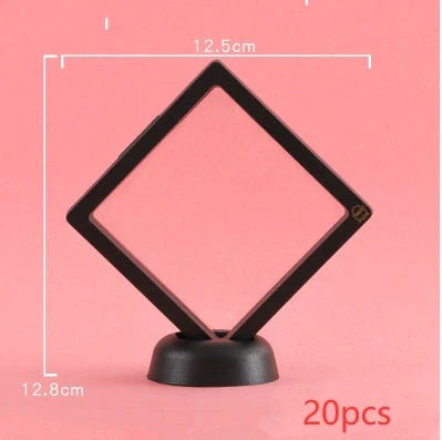 3D floating jewelry coin display stand in white and black, showcasing collectibles in mid-air