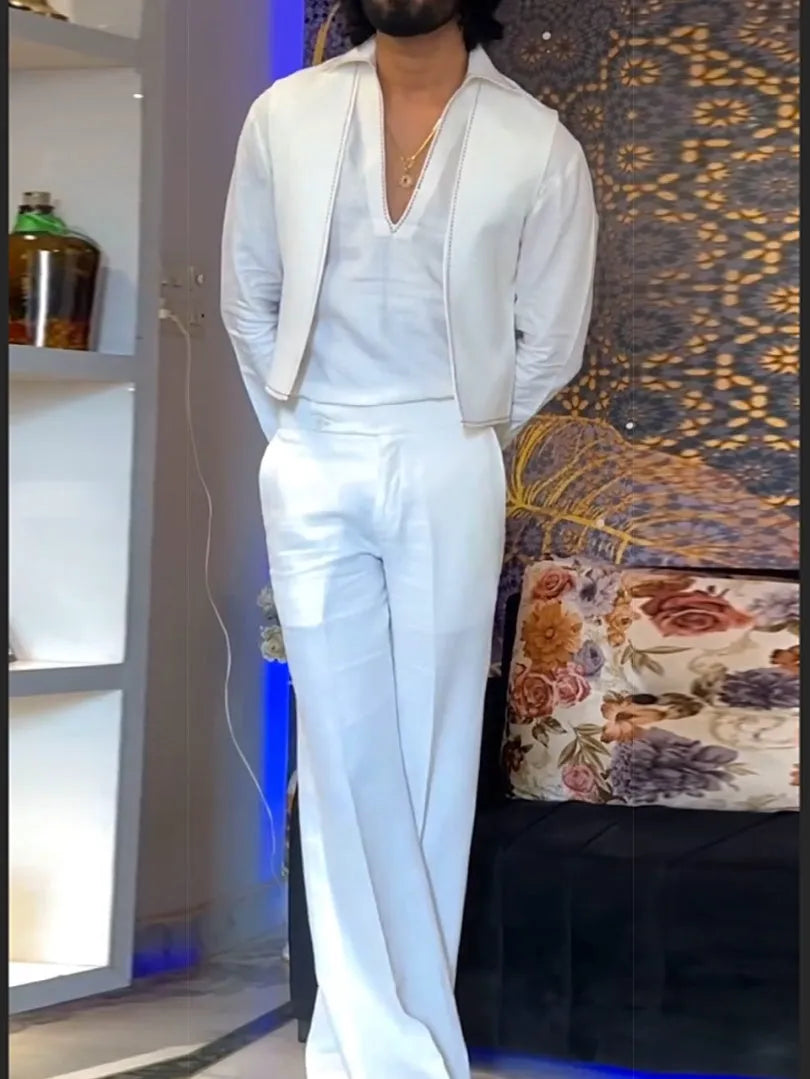 White three-piece outfit with V-neck shirt, sleeveless vest and trousers on hanger
