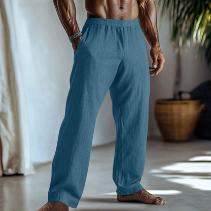 Straight leg cotton linen trousers in light green, shown with side pockets and a casual fit.