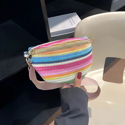 Blue and pink woven straw beach bag with single shoulder strap and zipper compartment
