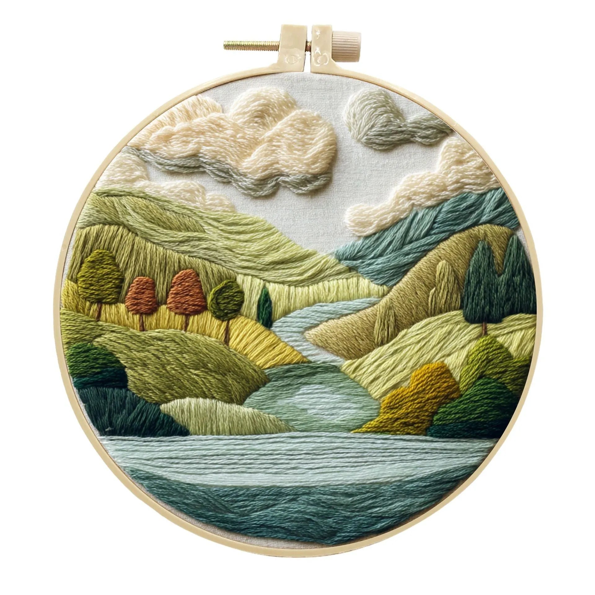 Complete DIY embroidery kit with 15cm bamboo frame, pre-printed landscape fabric, threads, and needles laid out.