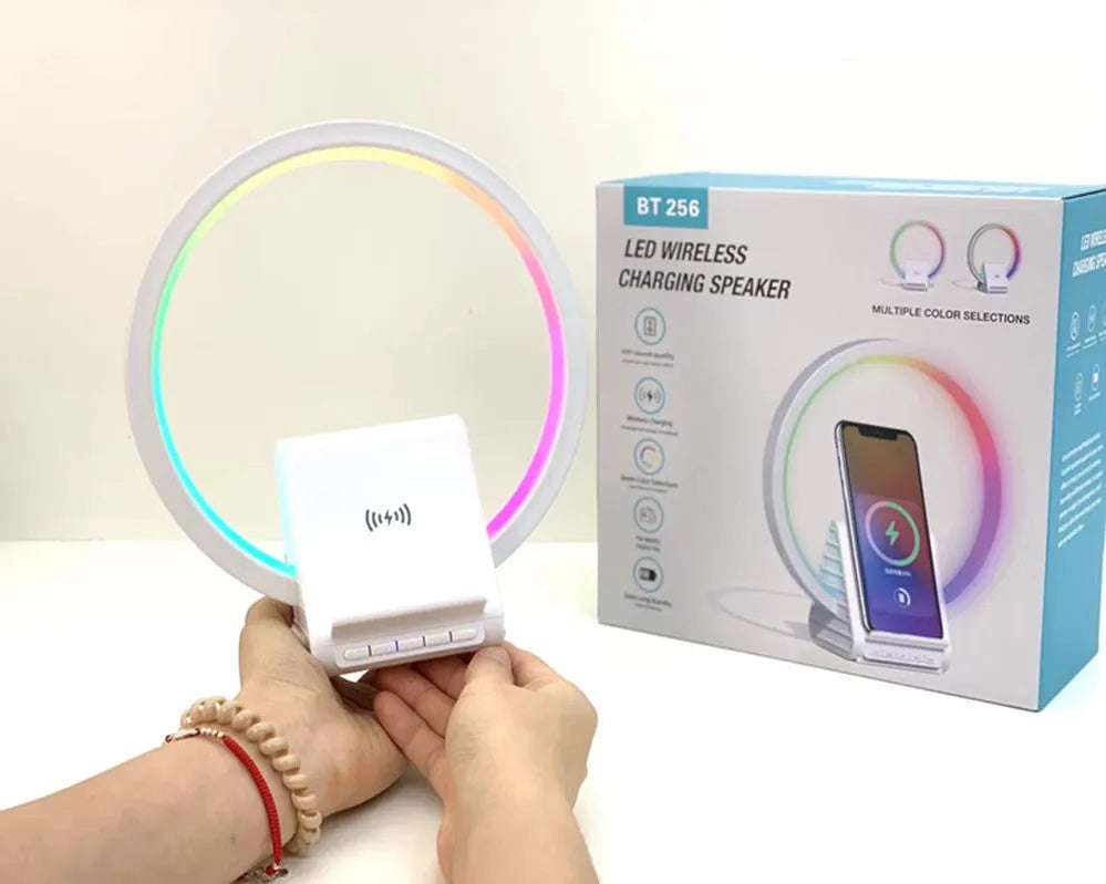 White smart Bluetooth speaker with ambience light and wireless charging pad