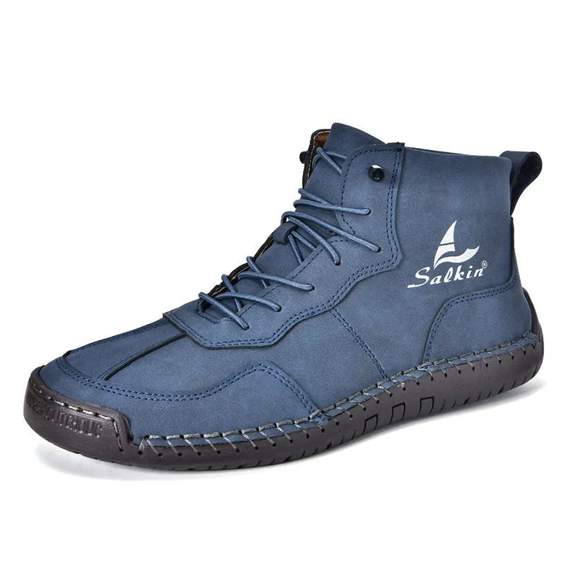 A pair of beige high-top casual boots with elastic band fastening and a flat rubber sole.
