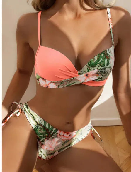 Women's printed two-piece bikini with push-up top and split hip briefs in various colours.