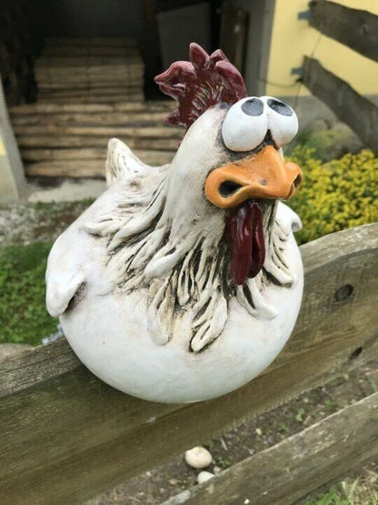 Resin chicken garden ornament with vibrant colours and charming design, adding whimsical appeal to outdoor British garden display
