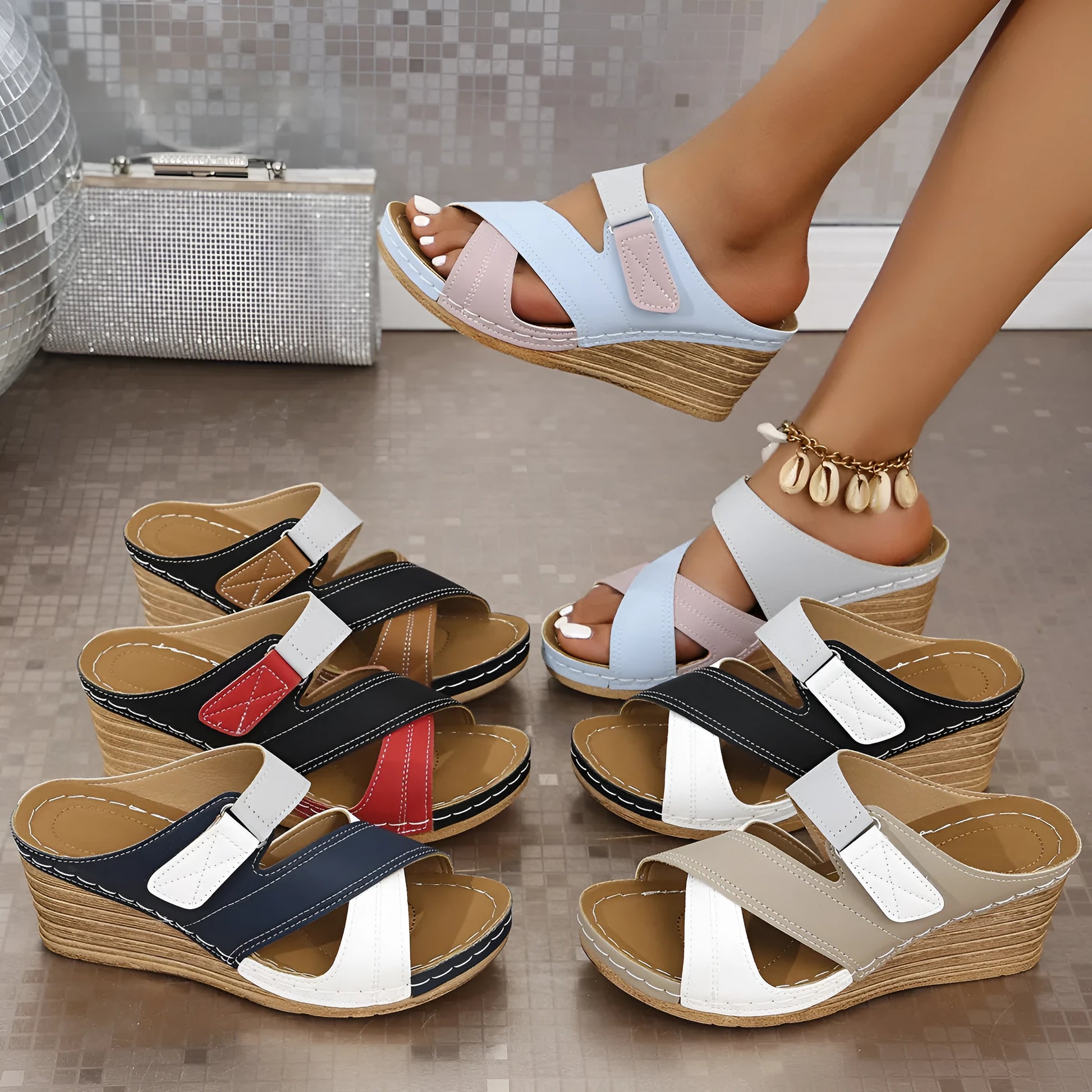 Women's black and red platform wedge slippers showing velcro strap and fish mouth toe design