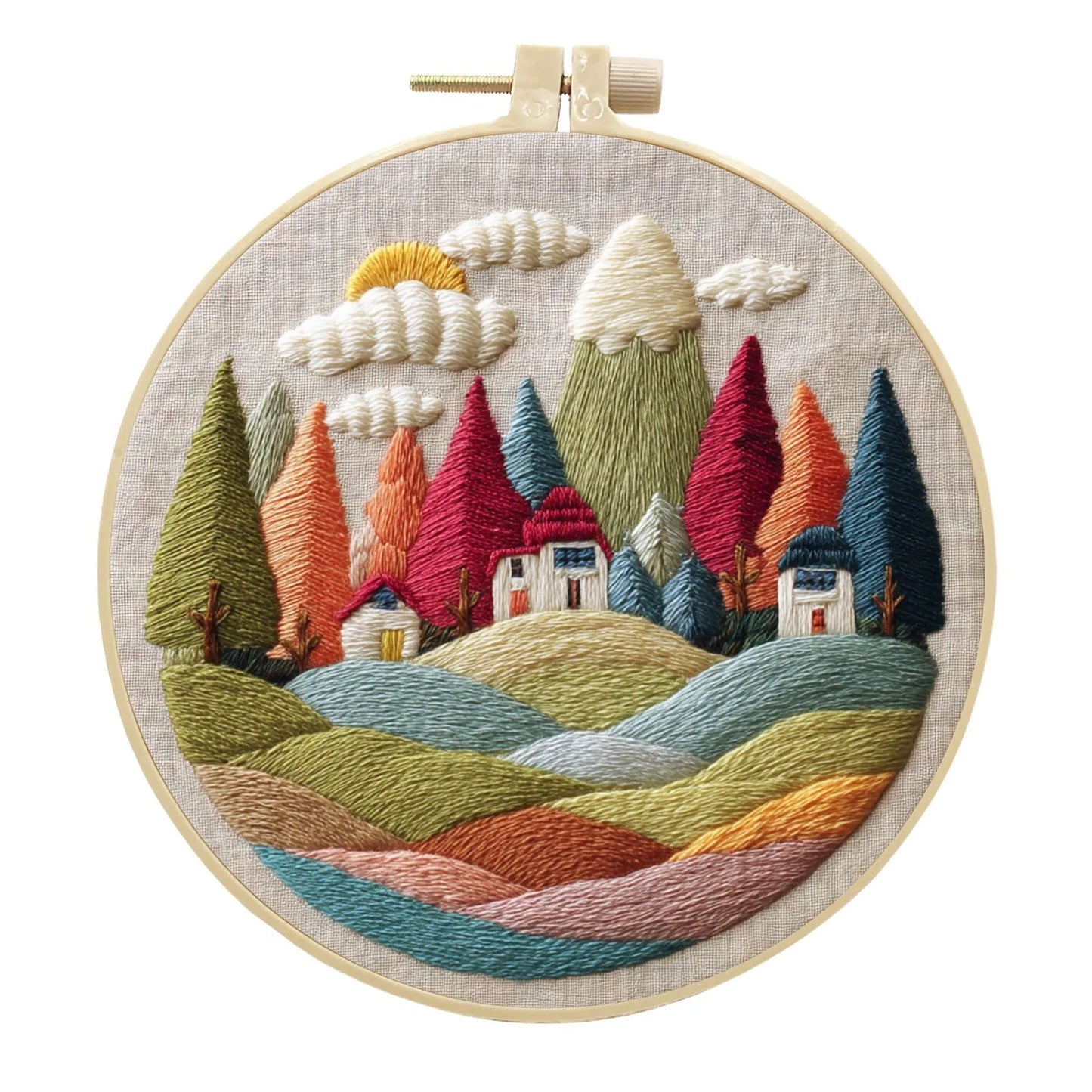 Complete DIY embroidery kit with 15cm bamboo frame, pre-printed landscape fabric, threads, and needles laid out.