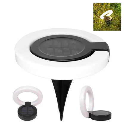 Solar-powered waterproof underground garden light showing its low-profile design and solar panel.