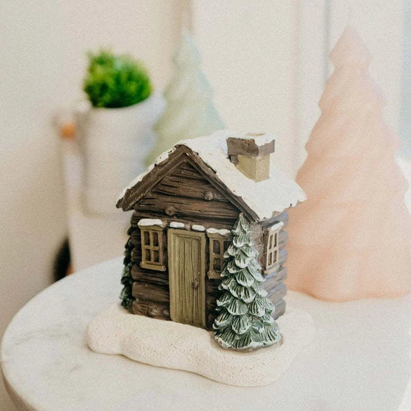 Rustic log cabin incense burner with intricate details, filling the air with soothing aromas