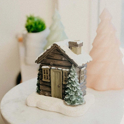 Rustic log cabin incense burner with intricate details, filling the air with soothing aromas