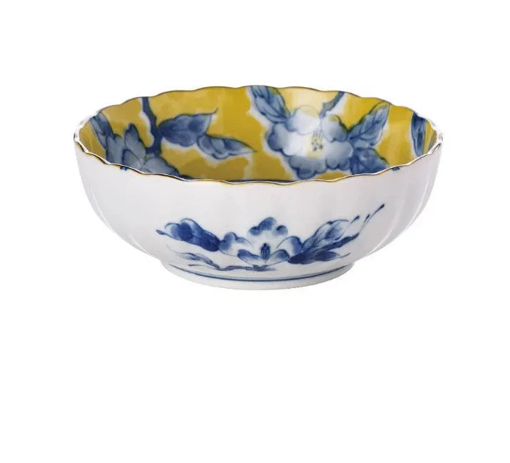 Yellow ceramic tableware set with colourful floral patterns, includes bowls and plates in Japanese style