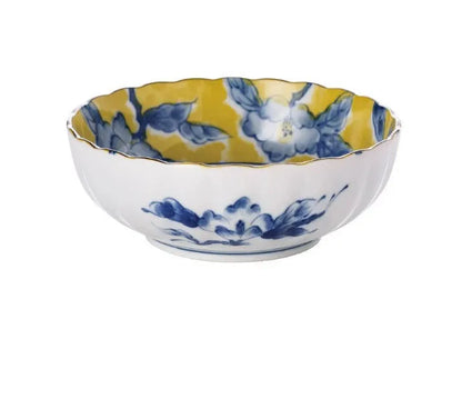 Yellow ceramic tableware set with colourful floral patterns, includes bowls and plates in Japanese style