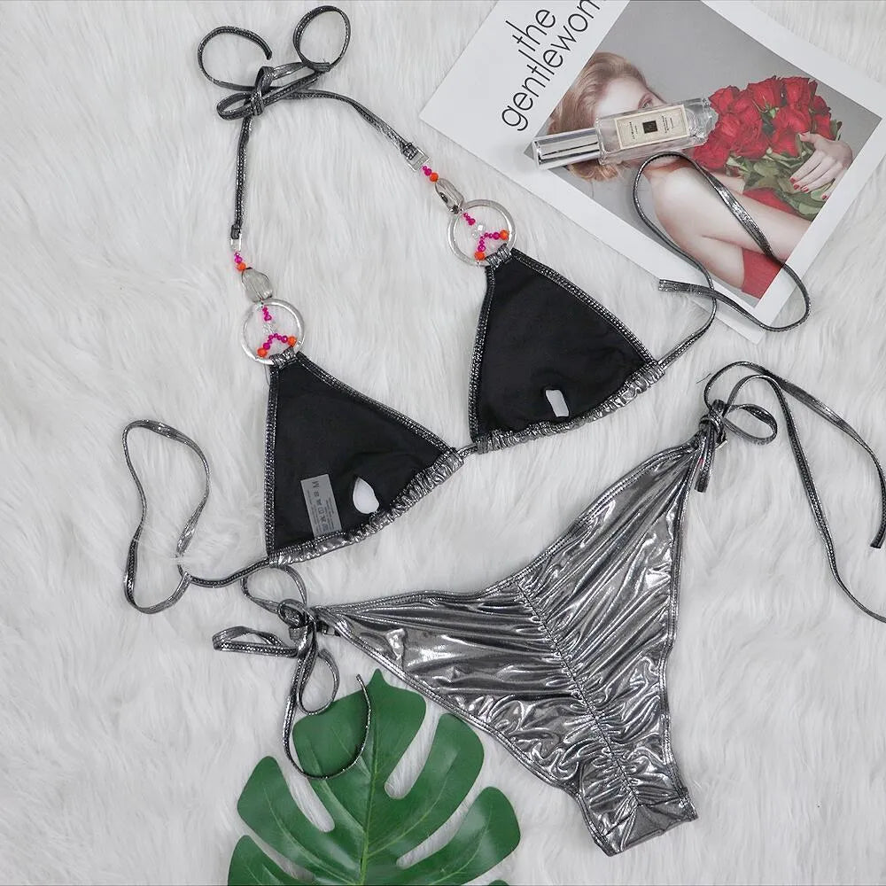 Silver women's bikini swimsuit with split briefs design on mannequin