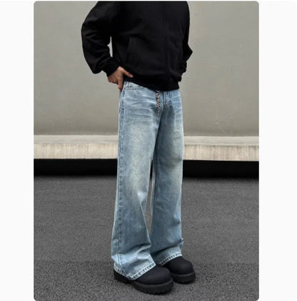 Men's blue straight leg jeans with whisker distressing and flared leg cut