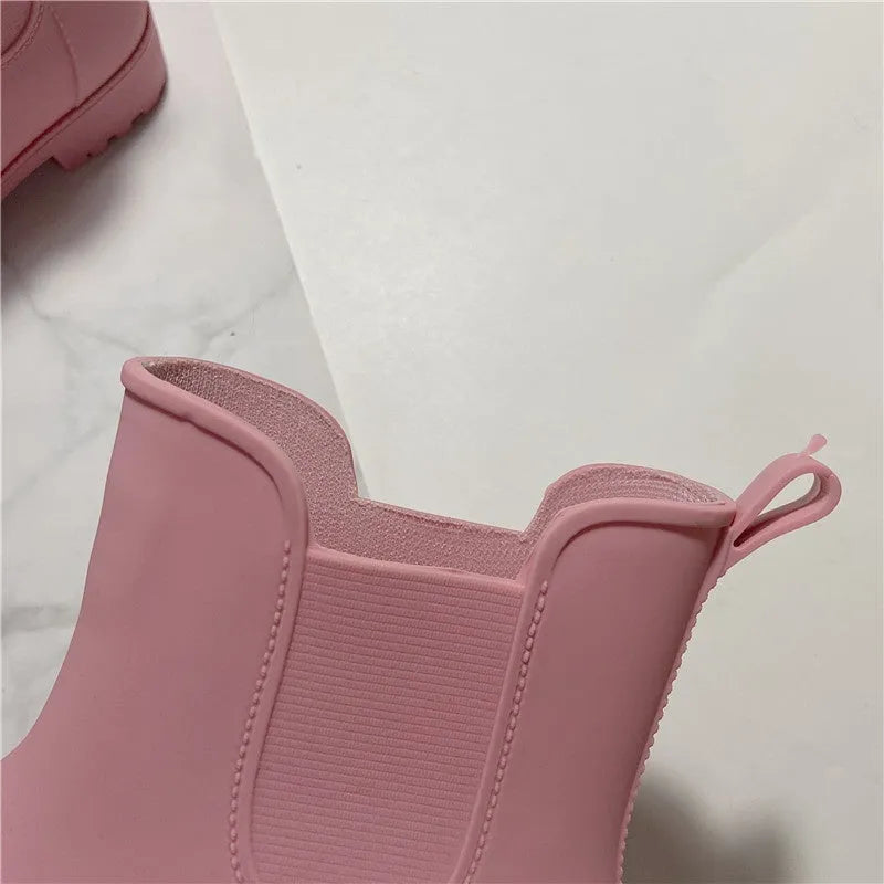 Pair of short casual PVC rain boots with non-slip sole and 3-5cm mid heel, shown in pink, milky white, and black