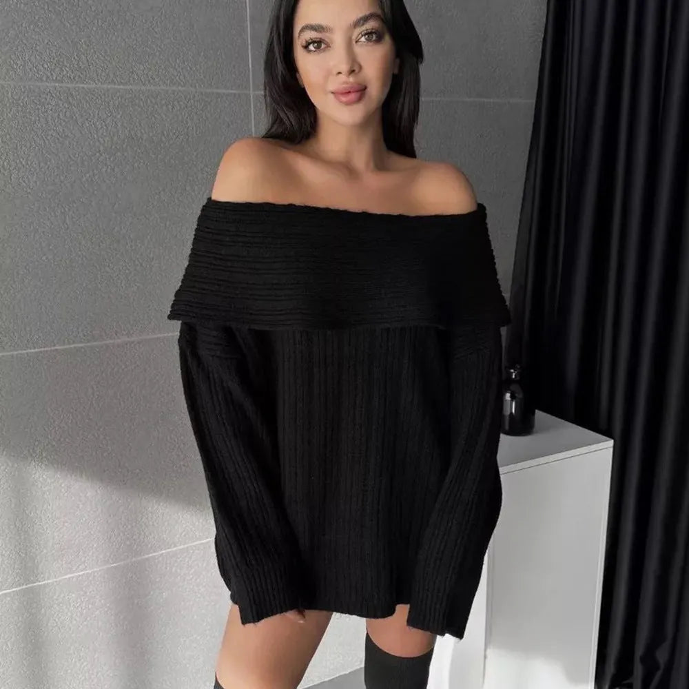Woman wearing a loose white acrylic knit pullover sweater with long sleeves and an off-neck design.