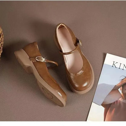 Flat leather shoes with wedge heel in black, featuring a skull pattern, round toe, and rubber sole.