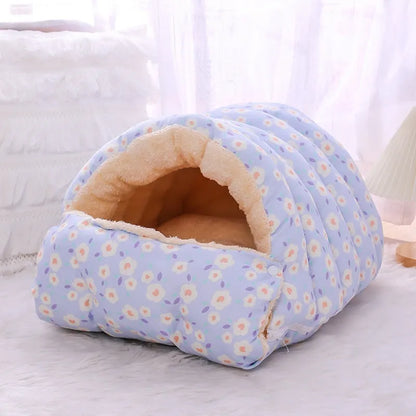 Enclosed winter cat nest with removable cover in a small blue flower print pattern.