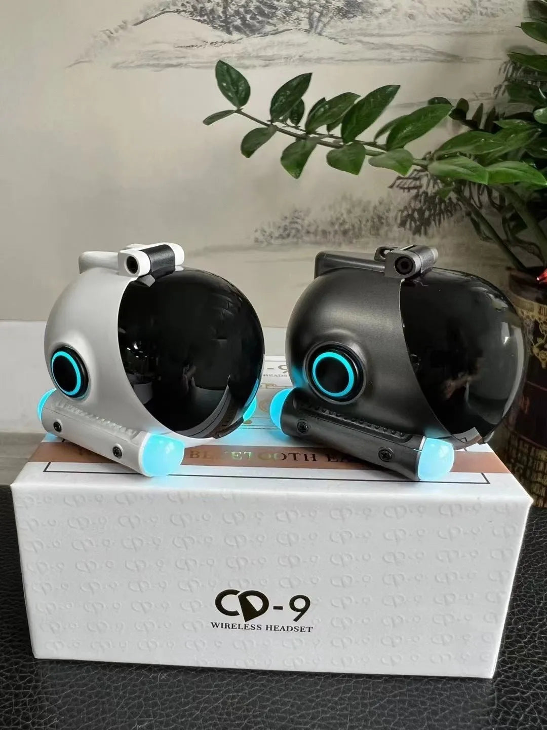 Black and white clip-on Bluetooth wireless sports headset showing ear clip design
