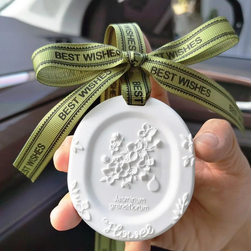 Car aromatherapy fragrant stone pendant with essential oil bottle on gift box