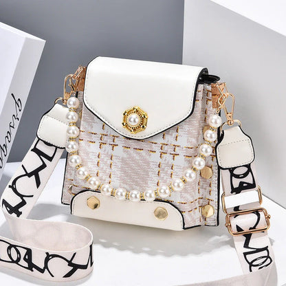 Stylish crossbody bag for women with delicate pearl pendant and adjustable strap for versatile carrying options